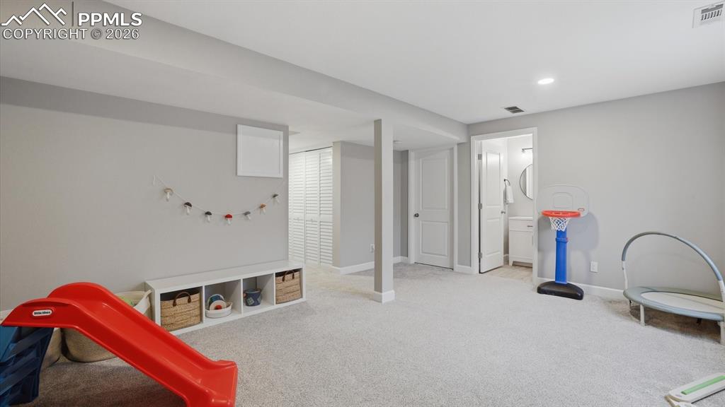 Image 36 of 50: Basement Family/Rec Room provides flexibility and expanded living space to