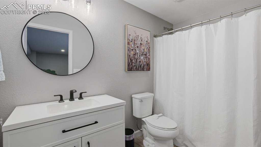 Image 37 of 50: Basement Family/Rec Room with neutral carpet and Full Bathroom.