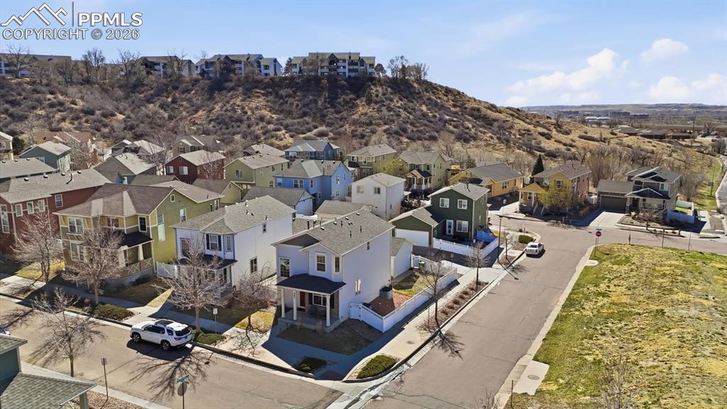 Image 4 of 50: Aerial view of the home, front, and side yards.