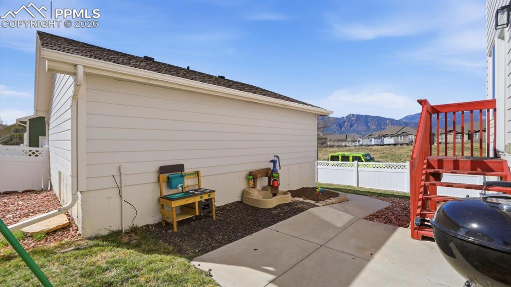 Image 40 of 50: Backyard patio for outdoor dining and relaxation with beautiful mountain vi