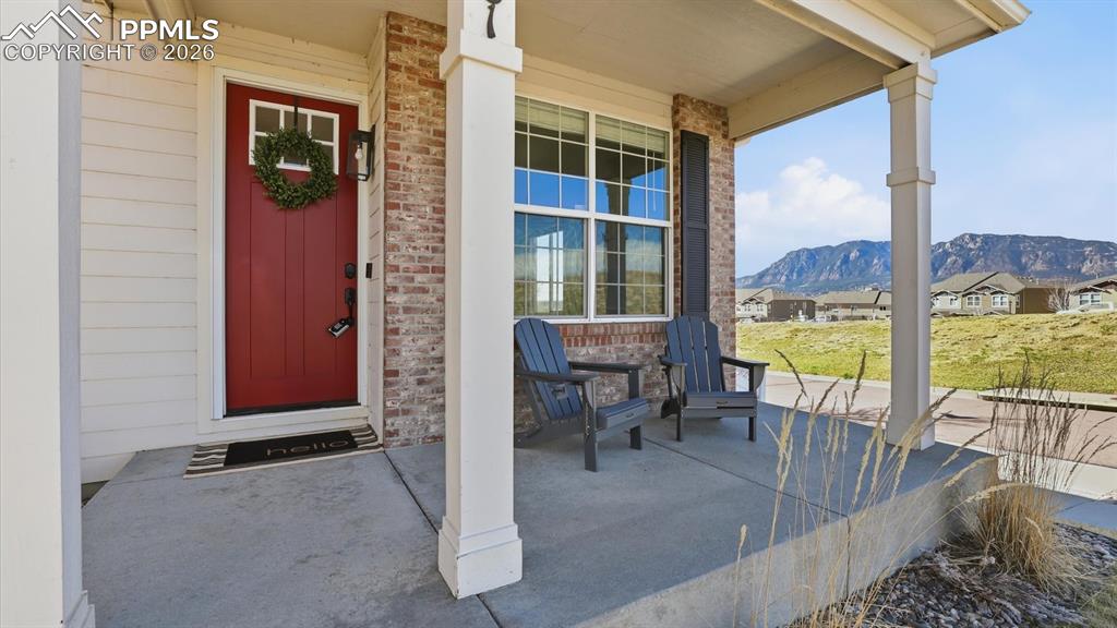Image 6 of 50: Covered front porch to enjoy Colorado