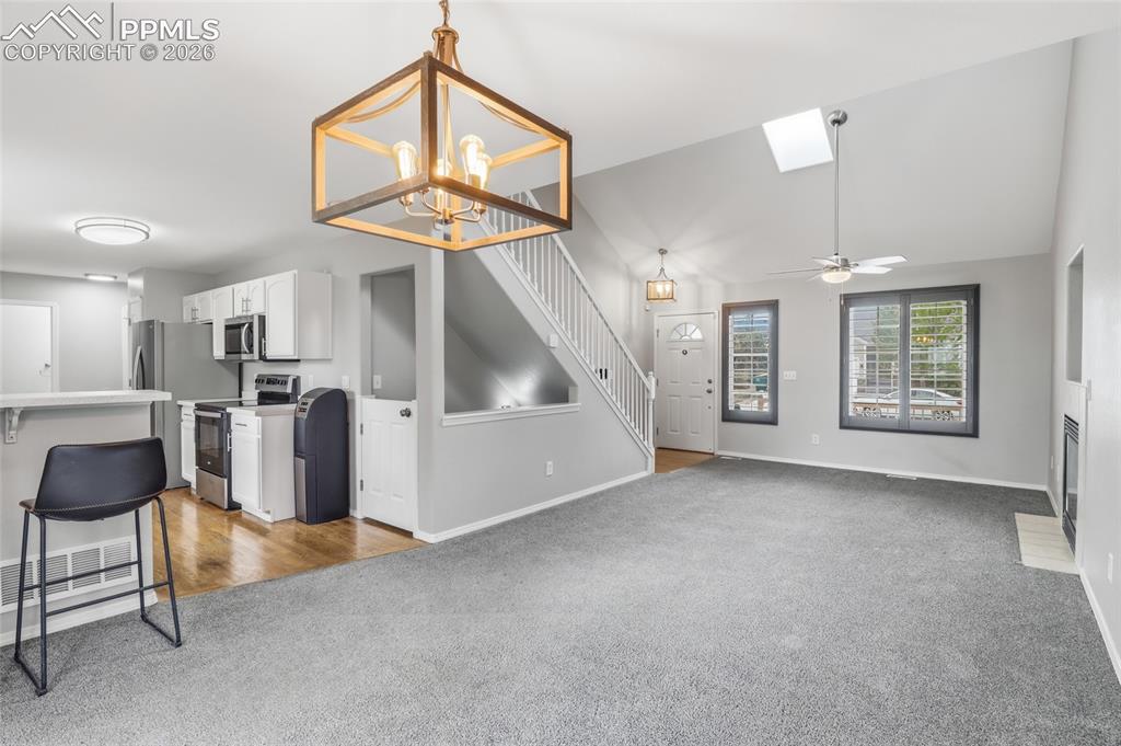 Image 6 of 36: Looking into the Kitchen & Living Room from Dining Room