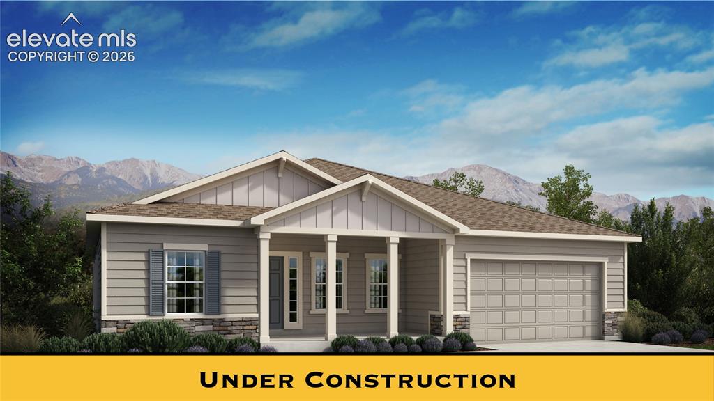 Caption: Single-story residence featuring horizontal siding, stone accent details, an attached two-car garage
