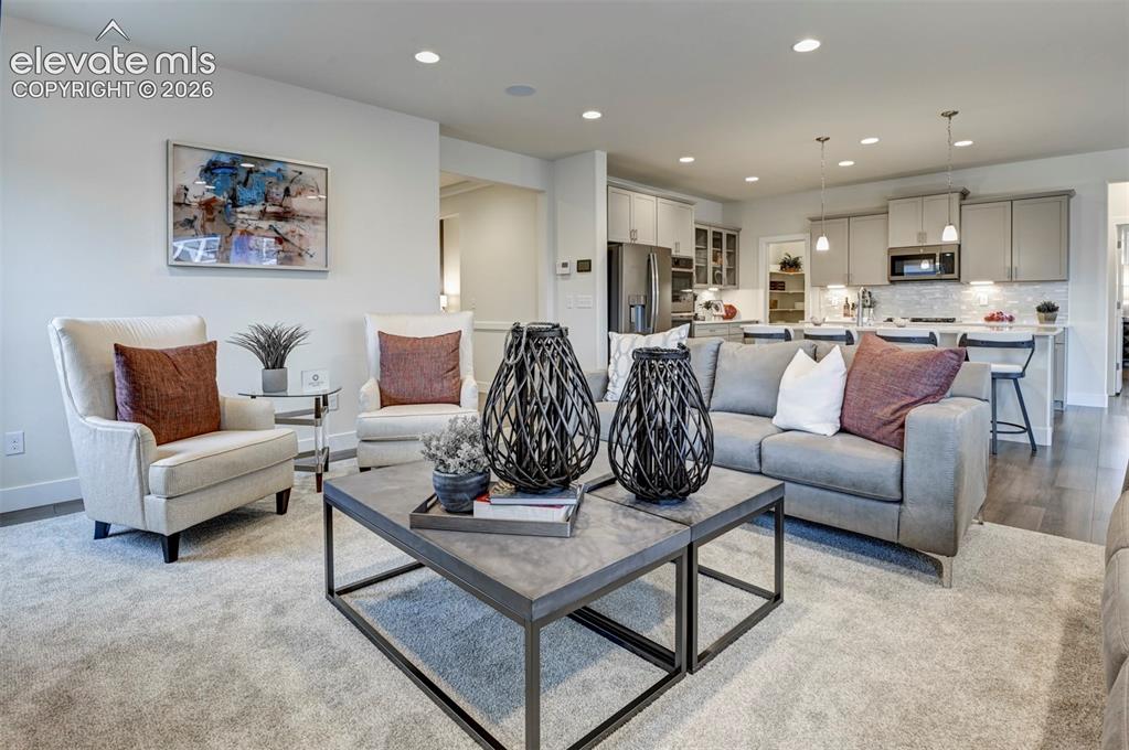 Image 10 of 31: Recessed ceiling lighting, light-toned wall finishes, wood-finish flooring,