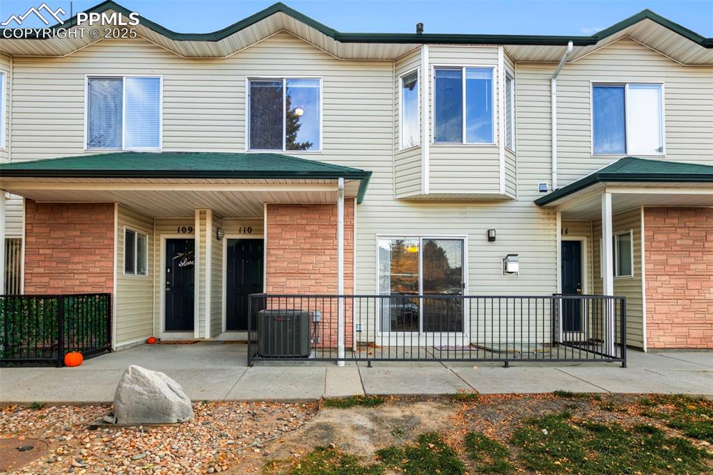 Caption: Rear view of property featuring a porch