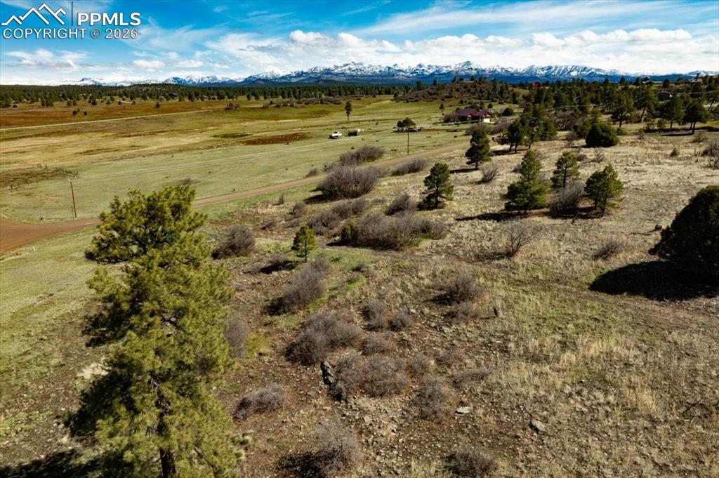 Image 12 of 31: View of mountain backdrop with rural landscape