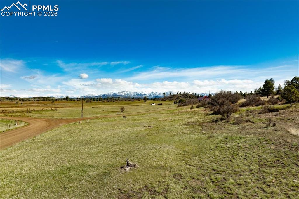 Image 14 of 31: View of grassy yard with a view of countryside