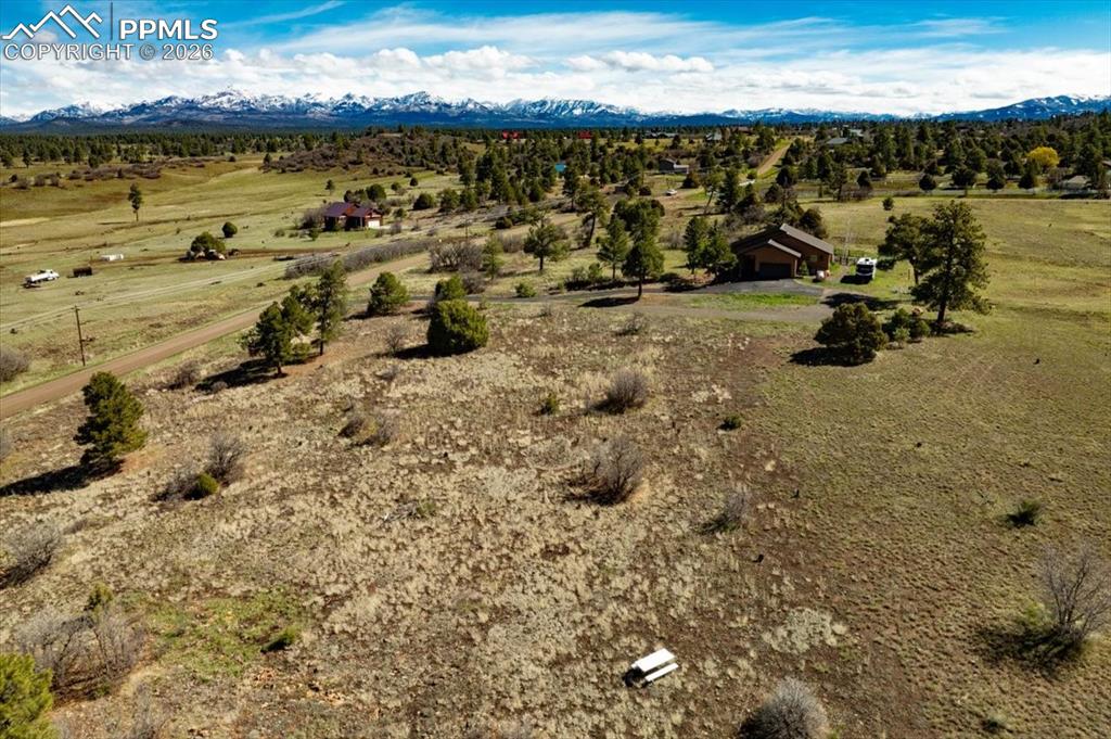 Image 6 of 31: View of rural area with a mountain backdrop