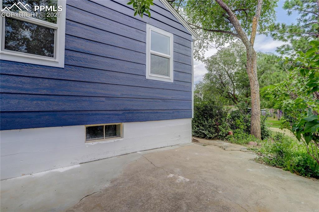 Image 18 of 21: Side patio for al fresco dining