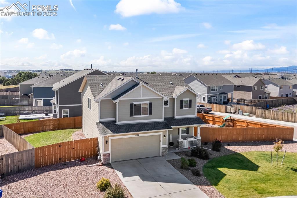 Image 36 of 40: View of front of house with a residential view, roof with shingles, concret