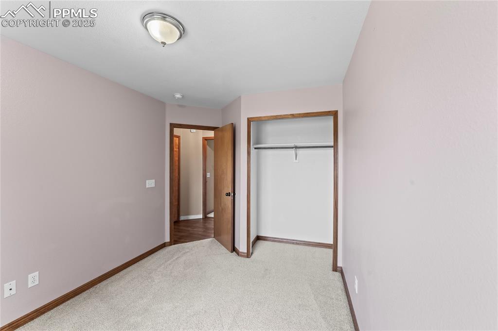 Image 31 of 42: Unfurnished bedroom featuring light colored carpet and a closet