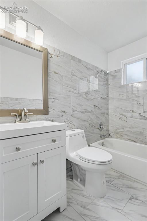 Image 32 of 43: Bright bathroom featuring a white vanity with a rectangular sink, a framed 