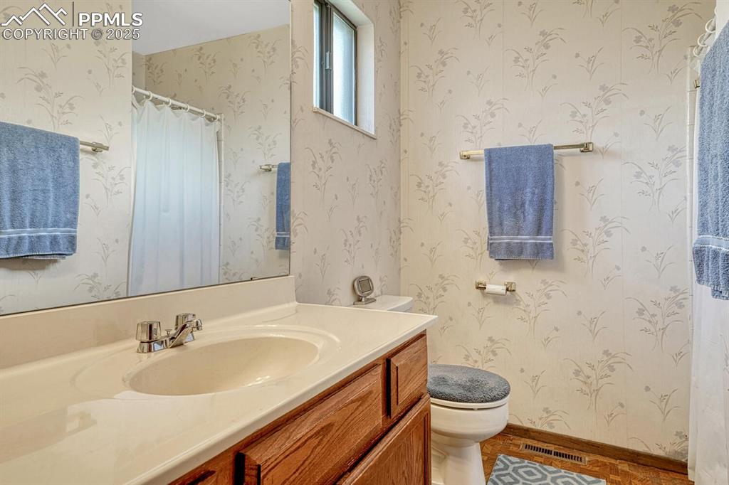 Image 26 of 46: 3/4 bathroom vanity, tile patterned floors. 