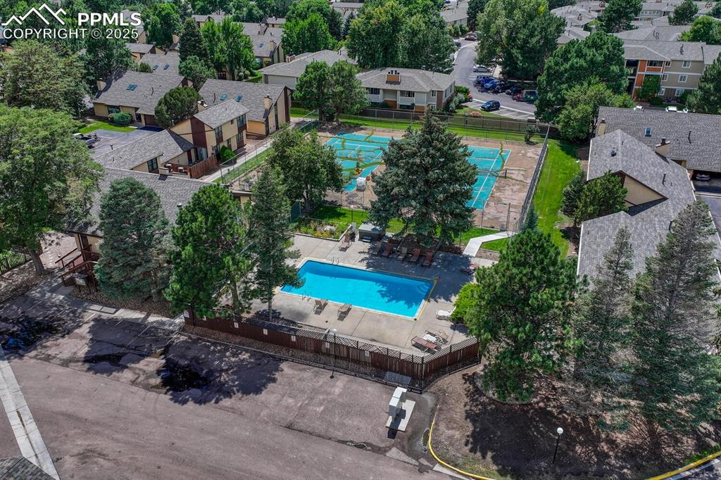 Image 44 of 46: Aerial view of property and surrounding area featuring a pool area and near