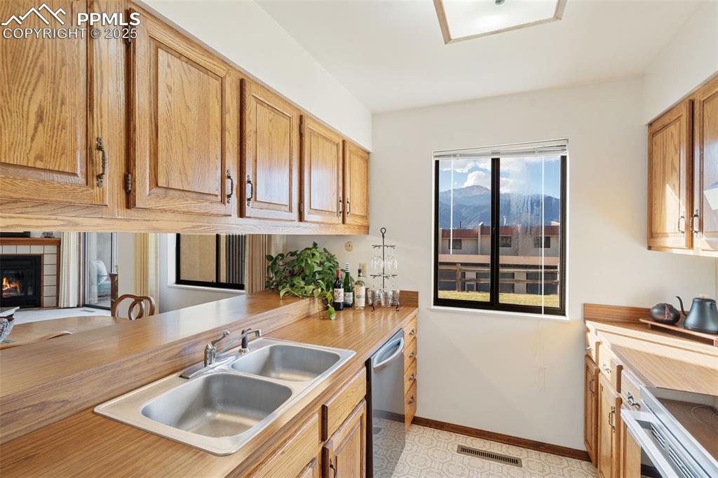 Image 17 of 28: The opening and counter space between the kitchen and dining area will come
