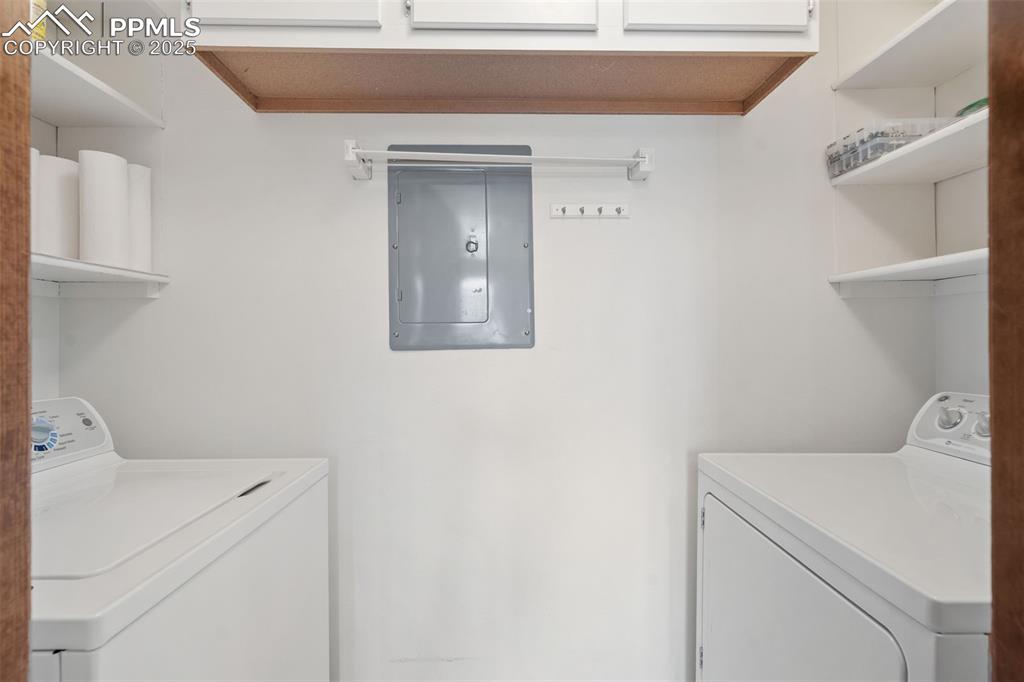 Image 20 of 28: The laundry area includes shelving, and the washer/dryer are included!