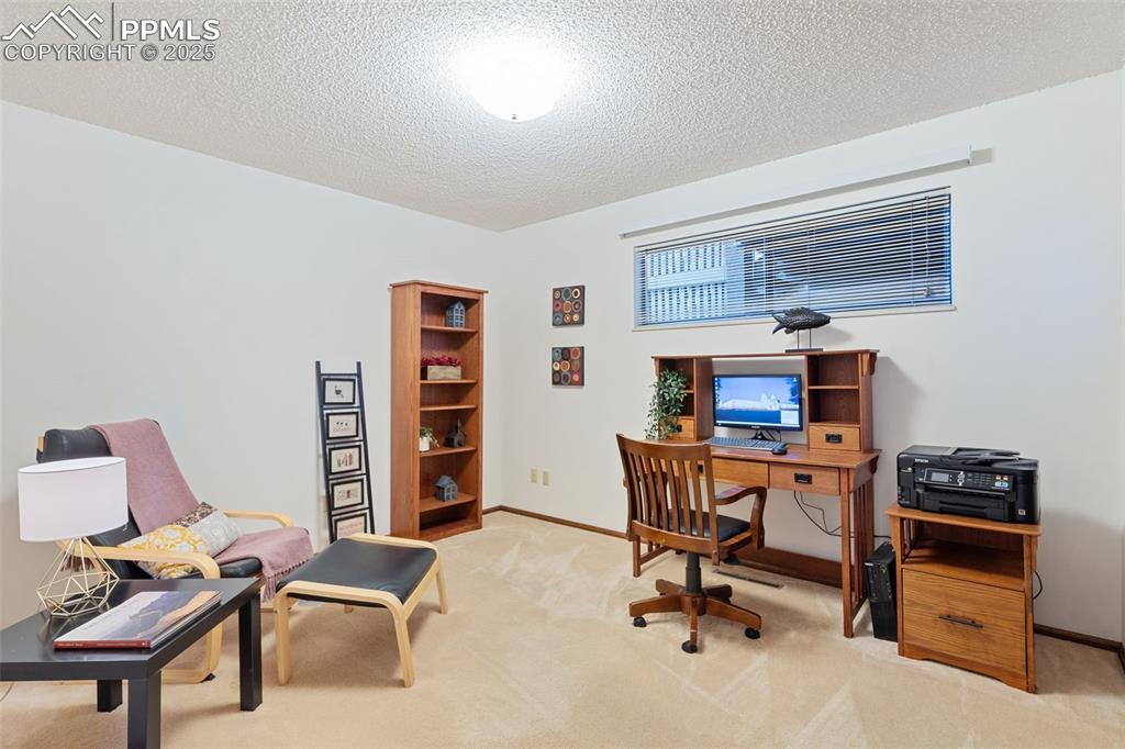 Image 24 of 28: Bedroom 2 is currently being used as an office.