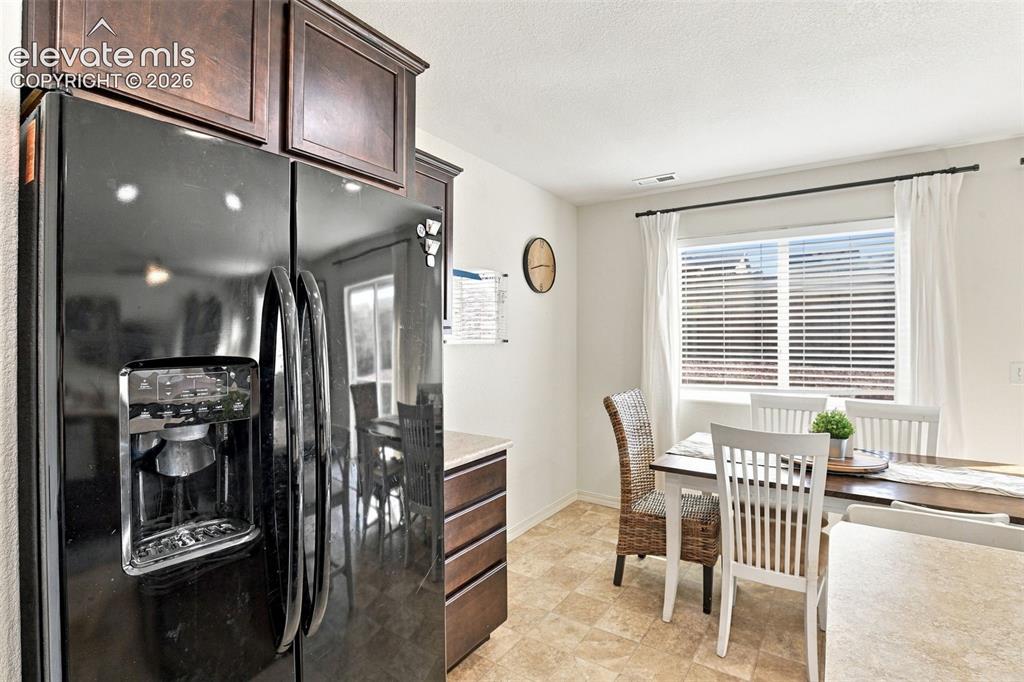 Image 17 of 48: Built-in refrigerator with ice and water dispenser, recessed panel upper ca