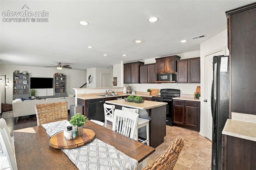 Image 20 of 48: Open-concept kitchen and dining area featuring recessed lighting, a kitchen