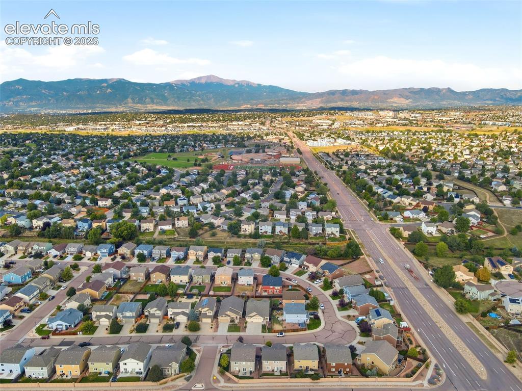 Image 46 of 48: Expansive residential neighborhood with mountain backdrop