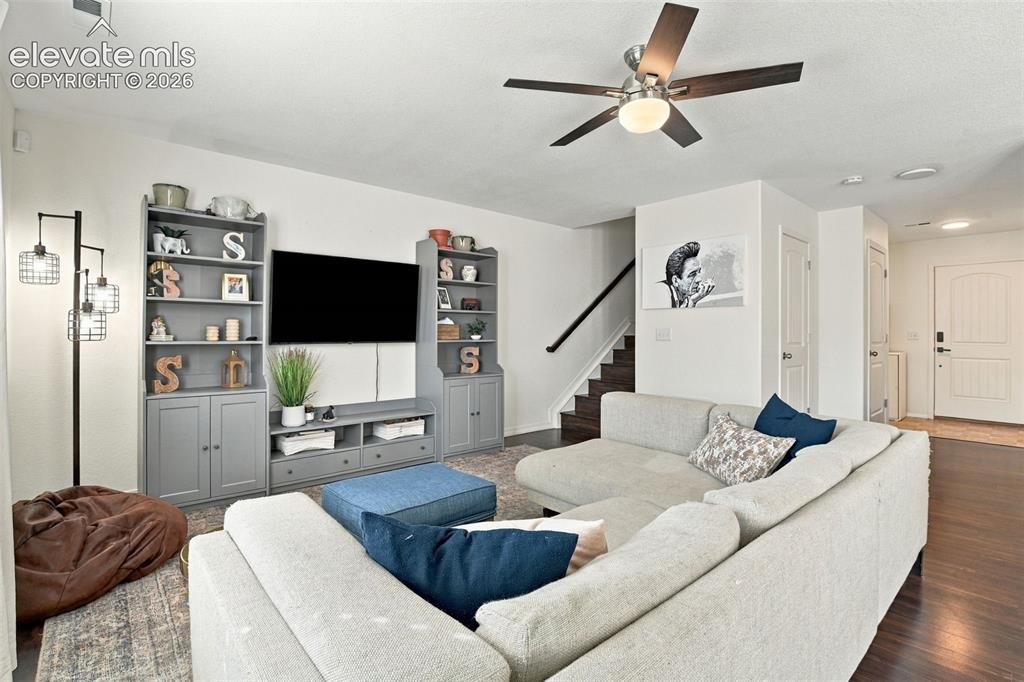 Image 7 of 48: Integrated entertainment center with shelving, dark wood-finish flooring, s
