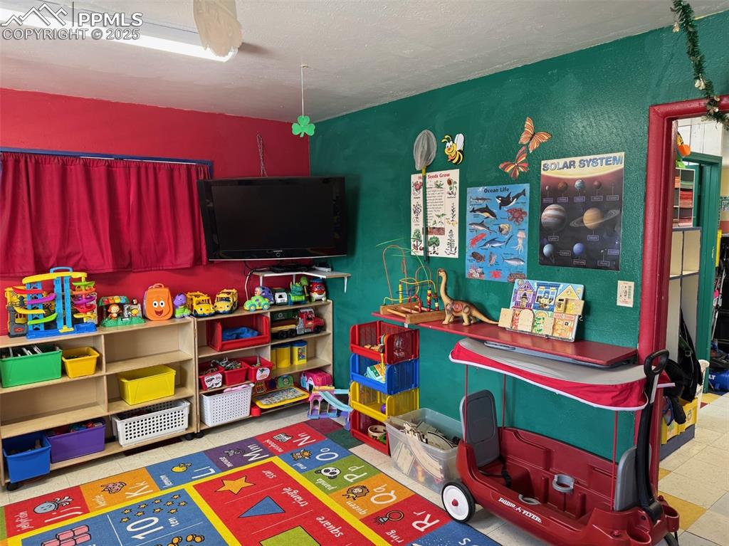 Image 15 of 33: Classroom featuring tile patterned floors