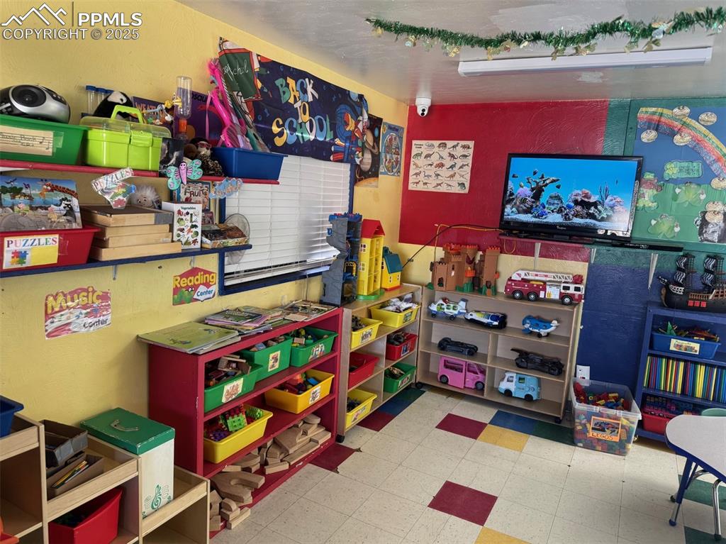 Image 9 of 33: Classroom featuring tile patterned floors