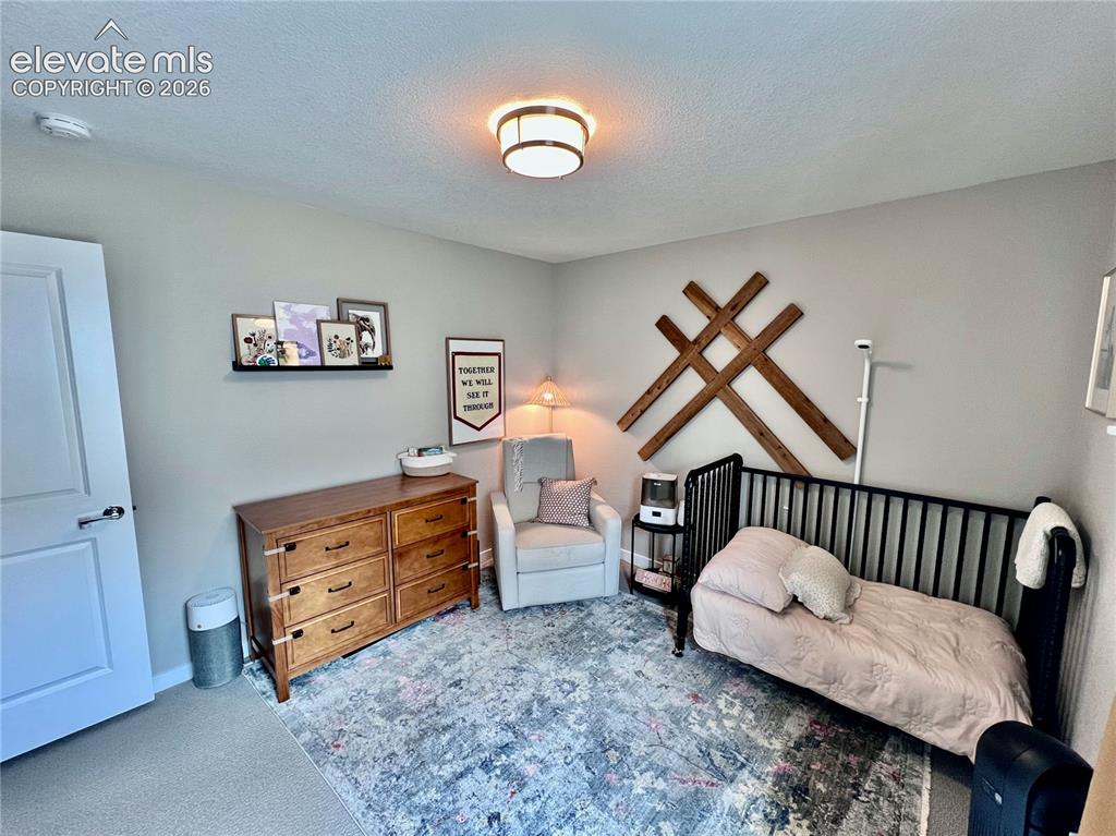 Image 16 of 20: Neutral tone wall color with a contrasting white door