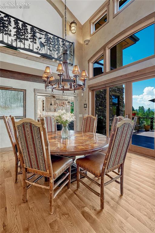 Image 21 of 50: Dining space with light wood-style flooring, healthy amount of natural ligh