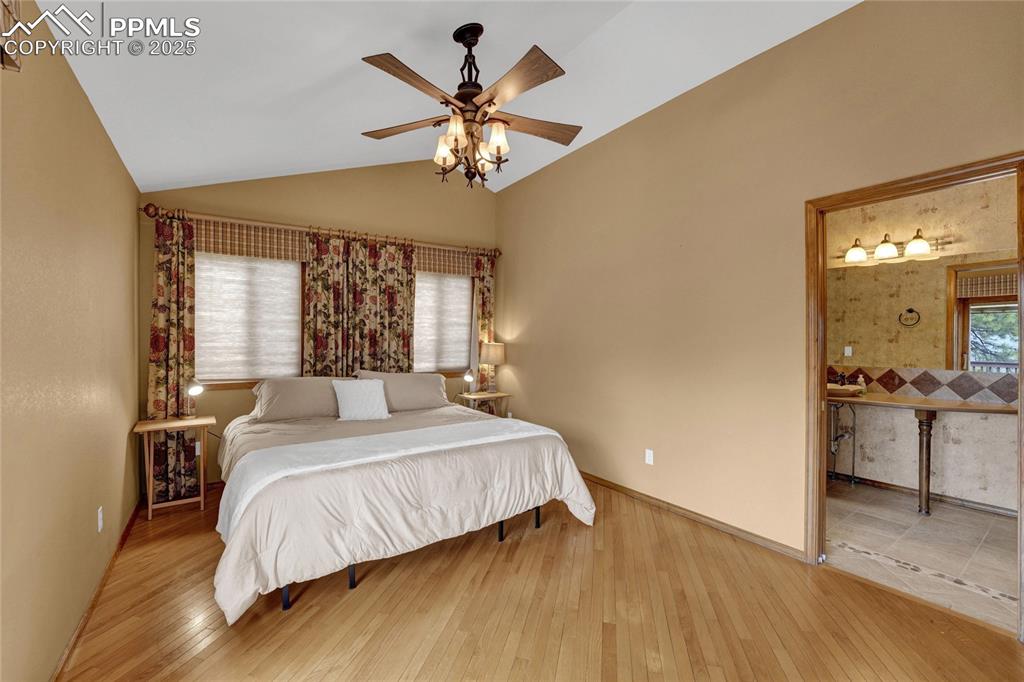 Image 31 of 50: Main level ensuite bedroom with walkout to deck 