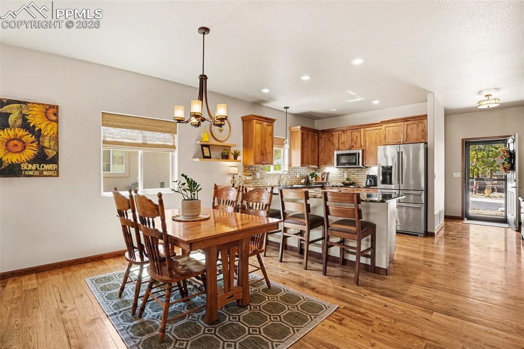 Image 12 of 35: The dining area is seamlessly combined with the kitchen, creating a functio