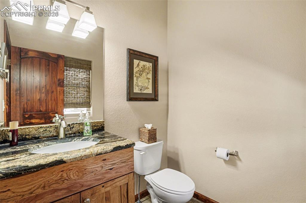 Image 13 of 35: Conveniently located near the entry, the main floor features a well-appoint