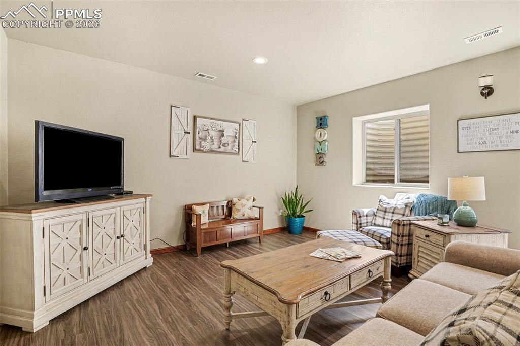 Image 22 of 35: The basement living area is incredibly spacious, providing a huge open spac