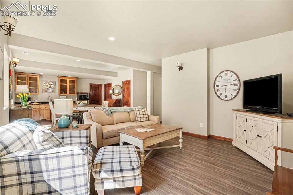 Image 23 of 35: Featuring durable and stylish luxury vinyl flooring, this Living room combi