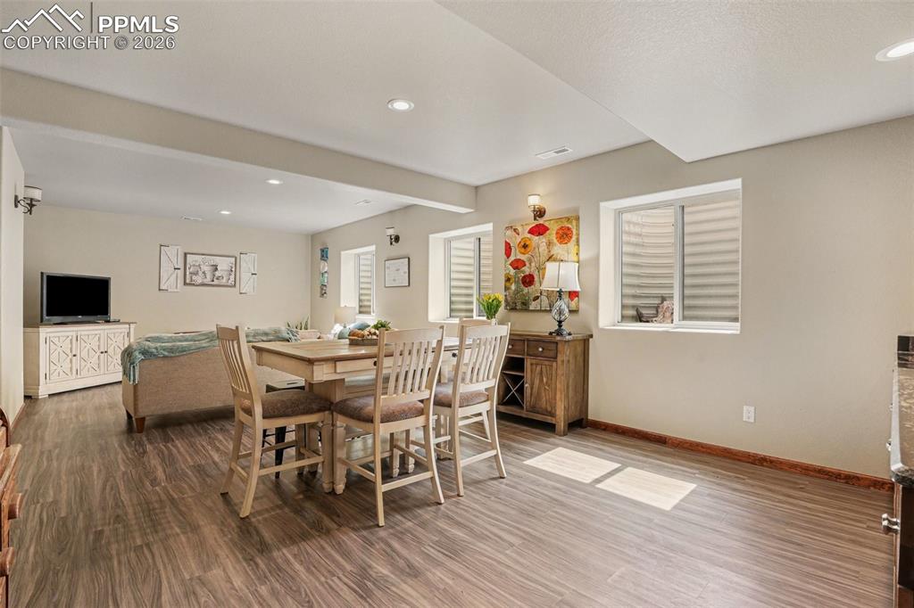 Image 24 of 35: This versatile space is perfect for hosting gatherings, movie nights, or ca