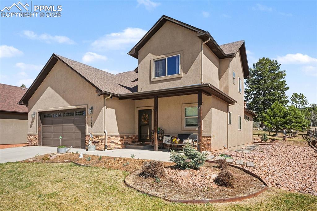 Image 3 of 35: The covered front porch provides wonderful shade—an ideal spot to relax and