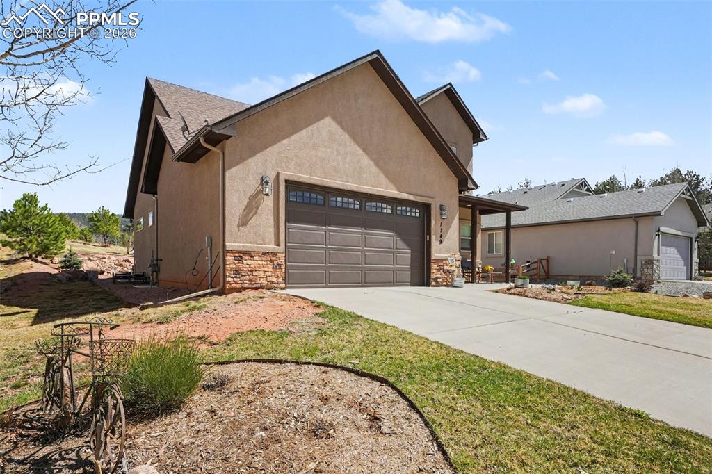 Image 4 of 35: The attached two-car garage adds both convenience and functionality, offeri