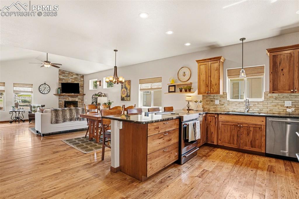 Image 6 of 35: The home features a bright and spacious open-concept layout, seamlessly con