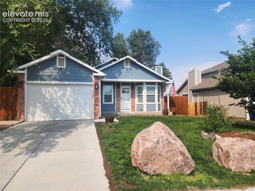 Image 1 of 49: Charming front exterior with modern blue siding