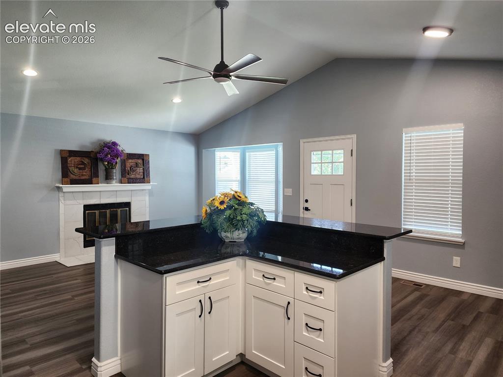 Image 10 of 49: Modern kitchen workspace perfectly open to the inviting living area