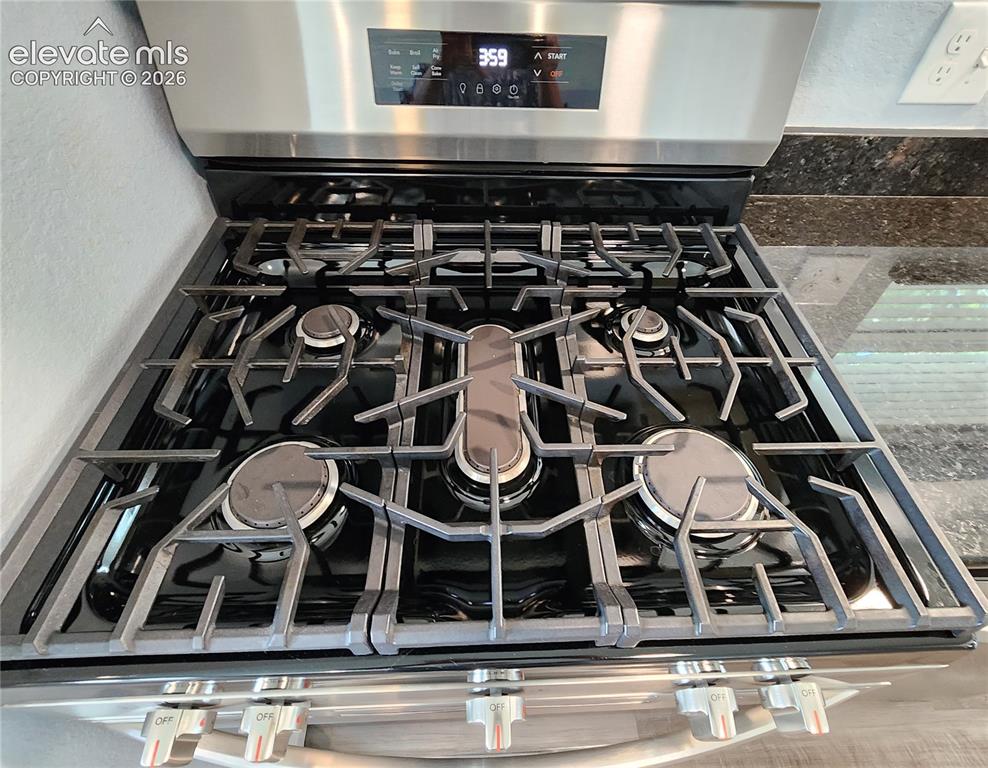 Image 16 of 49: Premium stainless steel gas range perfect for the home chef