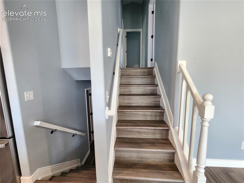 Image 22 of 49: Inviting staircase leading to the home