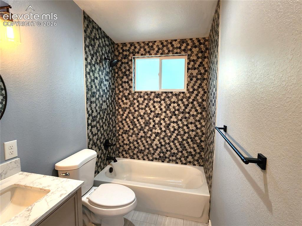 Image 24 of 49: Clean and stylish primary bathroom