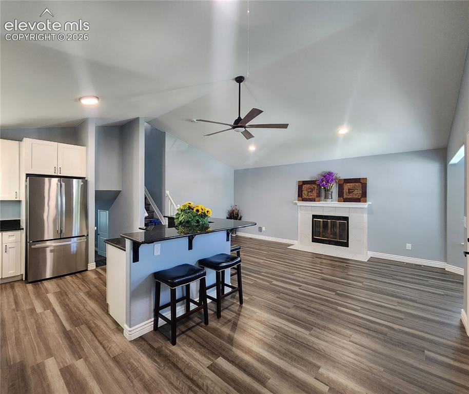 Image 5 of 49: Expansive, sun-drenched great room boasting high ceiling and recessed light