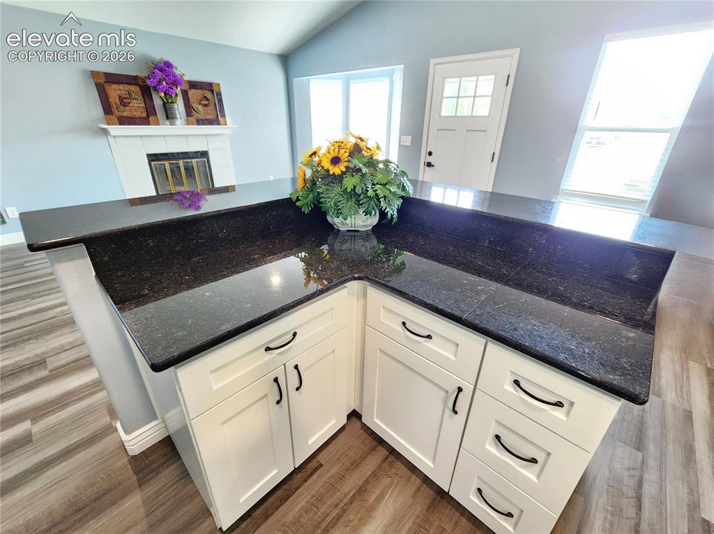 Image 9 of 49: Functional L-shaped counter space designed for effortless meal preparation