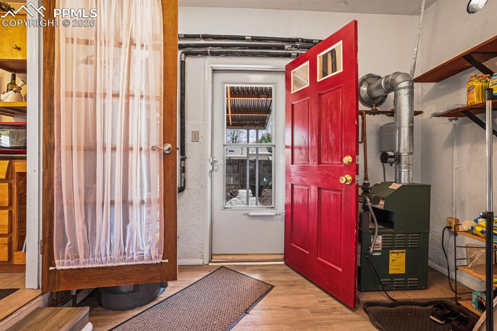 Image 15 of 27: Walkout to the backyard from the Laundry Room.