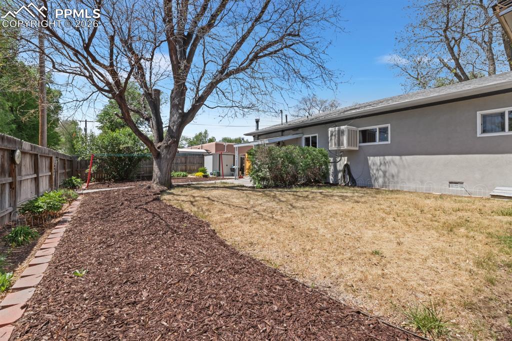 Image 25 of 27: Spacious fenced backyard for the kids and pets to run and play.