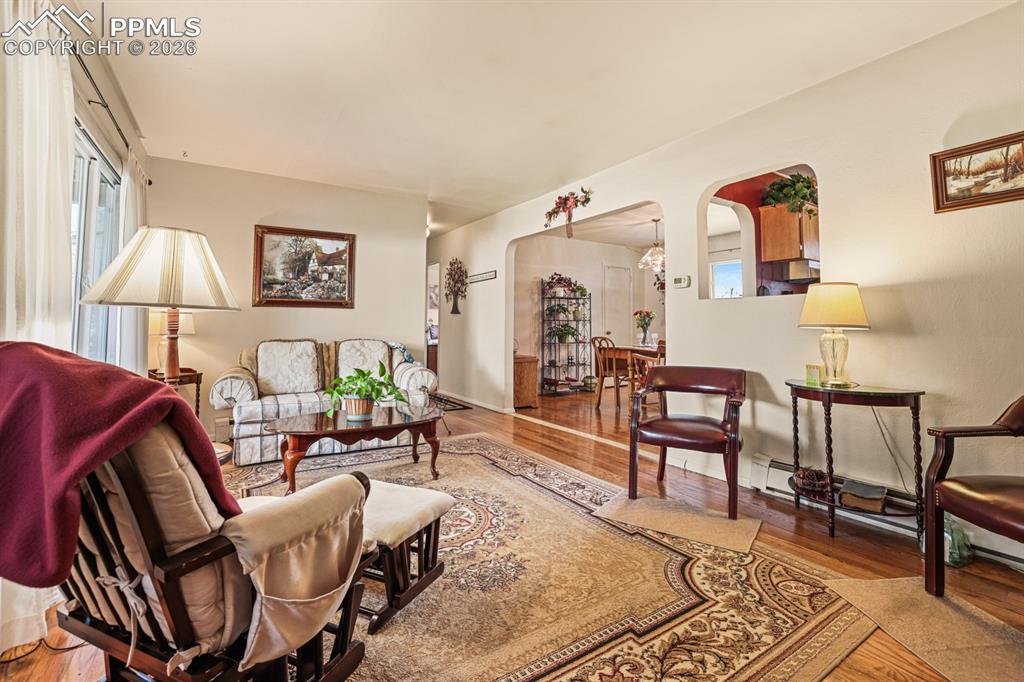 Image 5 of 27: The Living Room flows easily into the Dining Room and has a pass through in