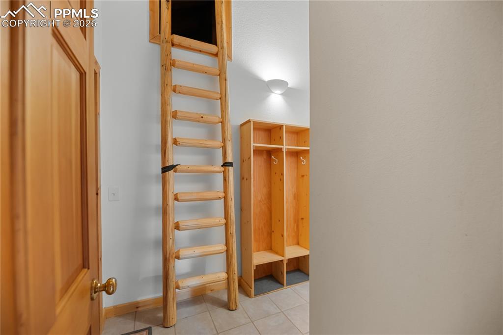 Image 18 of 45: Mudroom with light tile patterned flooring