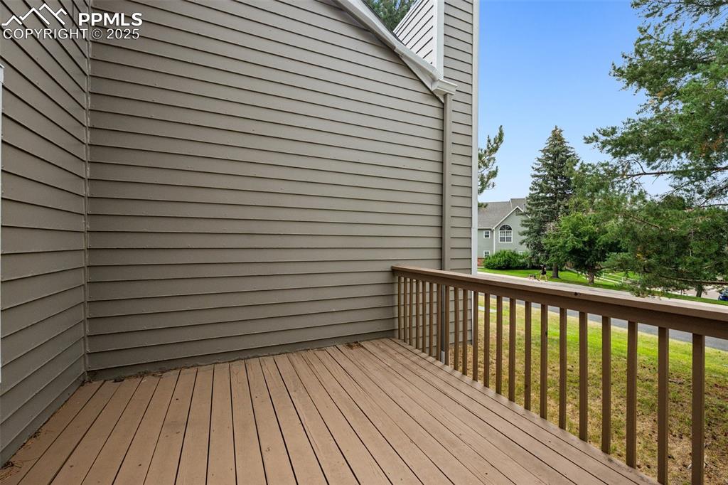 Image 15 of 48: Wooden deck featuring a yard